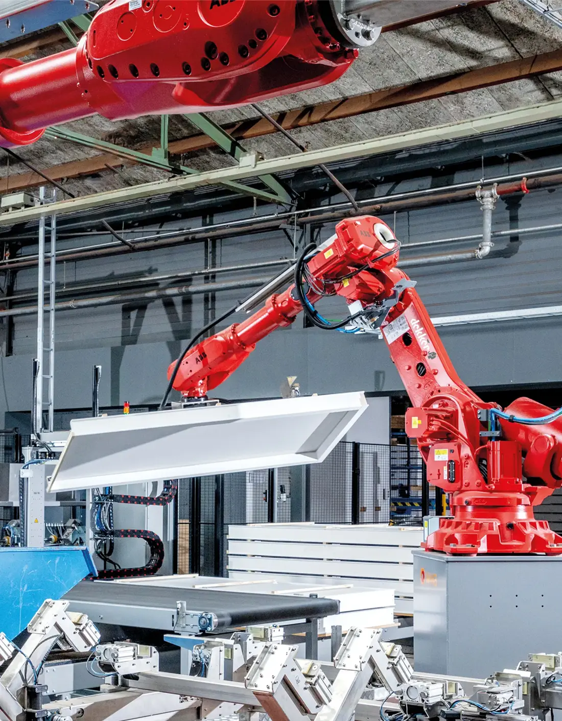 Dekker Hout robot arm in production facility, handling doors