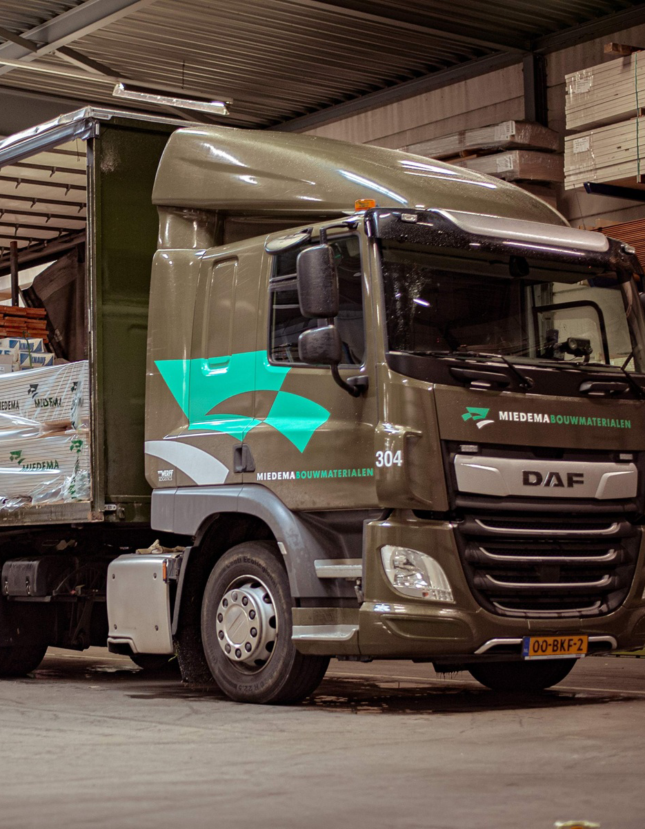 Miedema truck loading materials in warehouse for case study